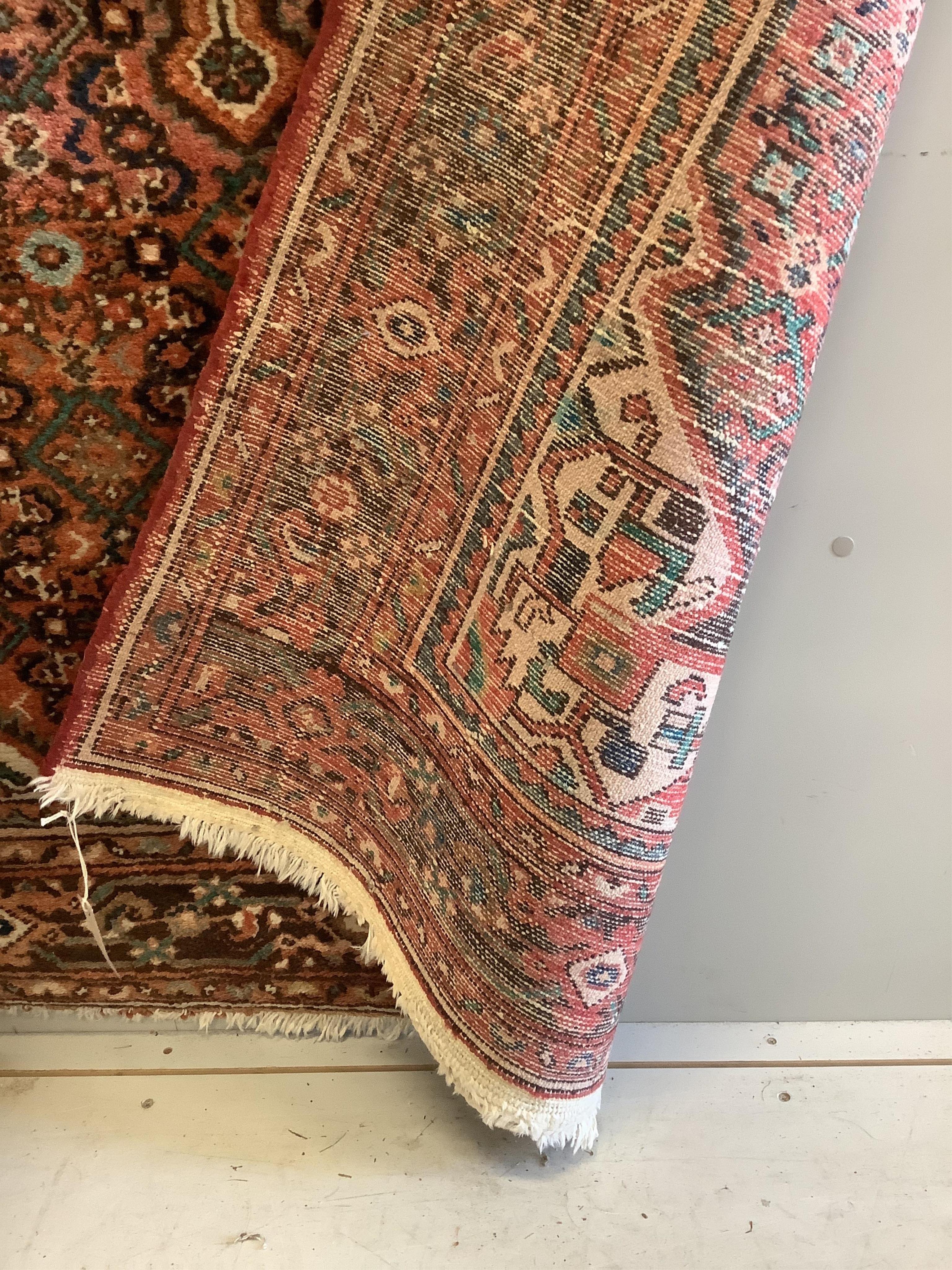 A Hamadan red ground rug, approx. 220 x 160cm. Condition - fair